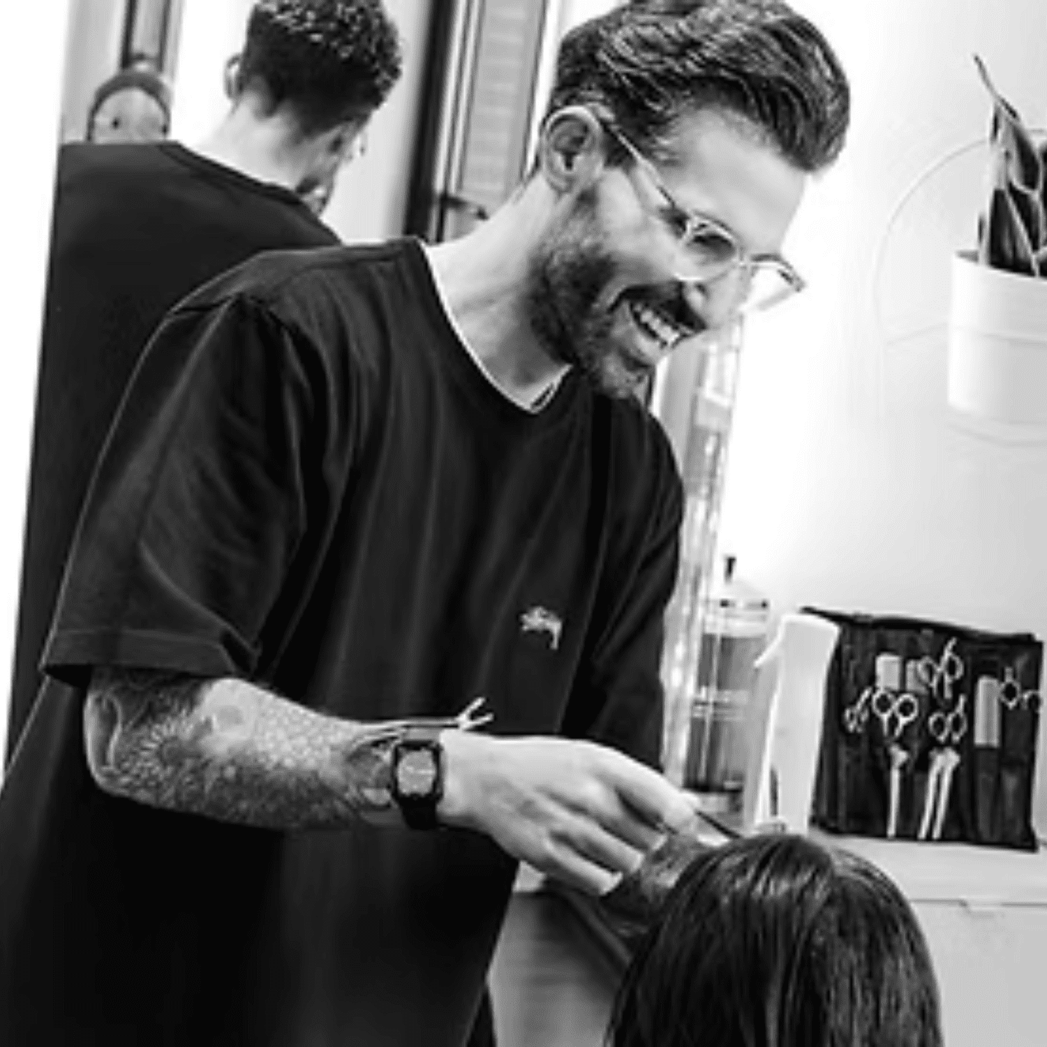 Portrait of Michael DePinto, a professional stylist at Salon Caru, showcasing their expertise and style.
