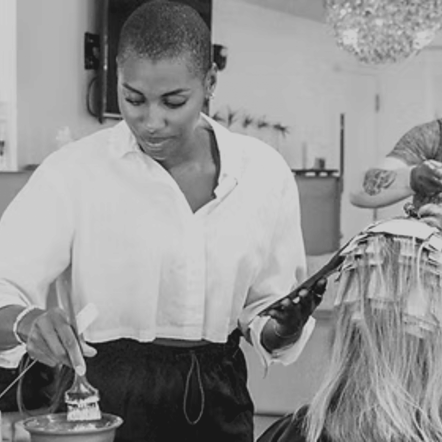 Portrait of Ashley Simon, a professional stylist at Salon Caru, showcasing their expertise and style.
