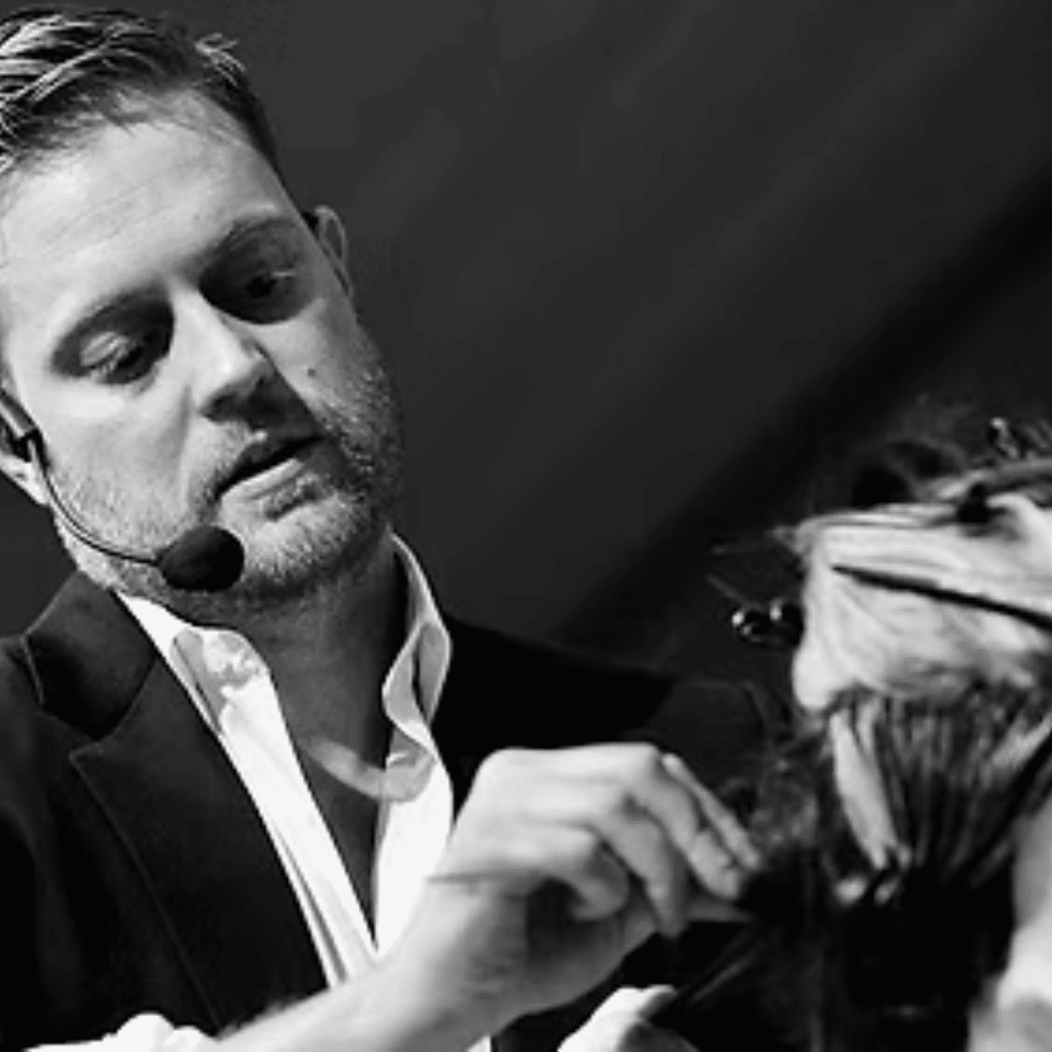 Portrait of Colin Caruso, a professional stylist at Salon Caru, showcasing their expertise and style.